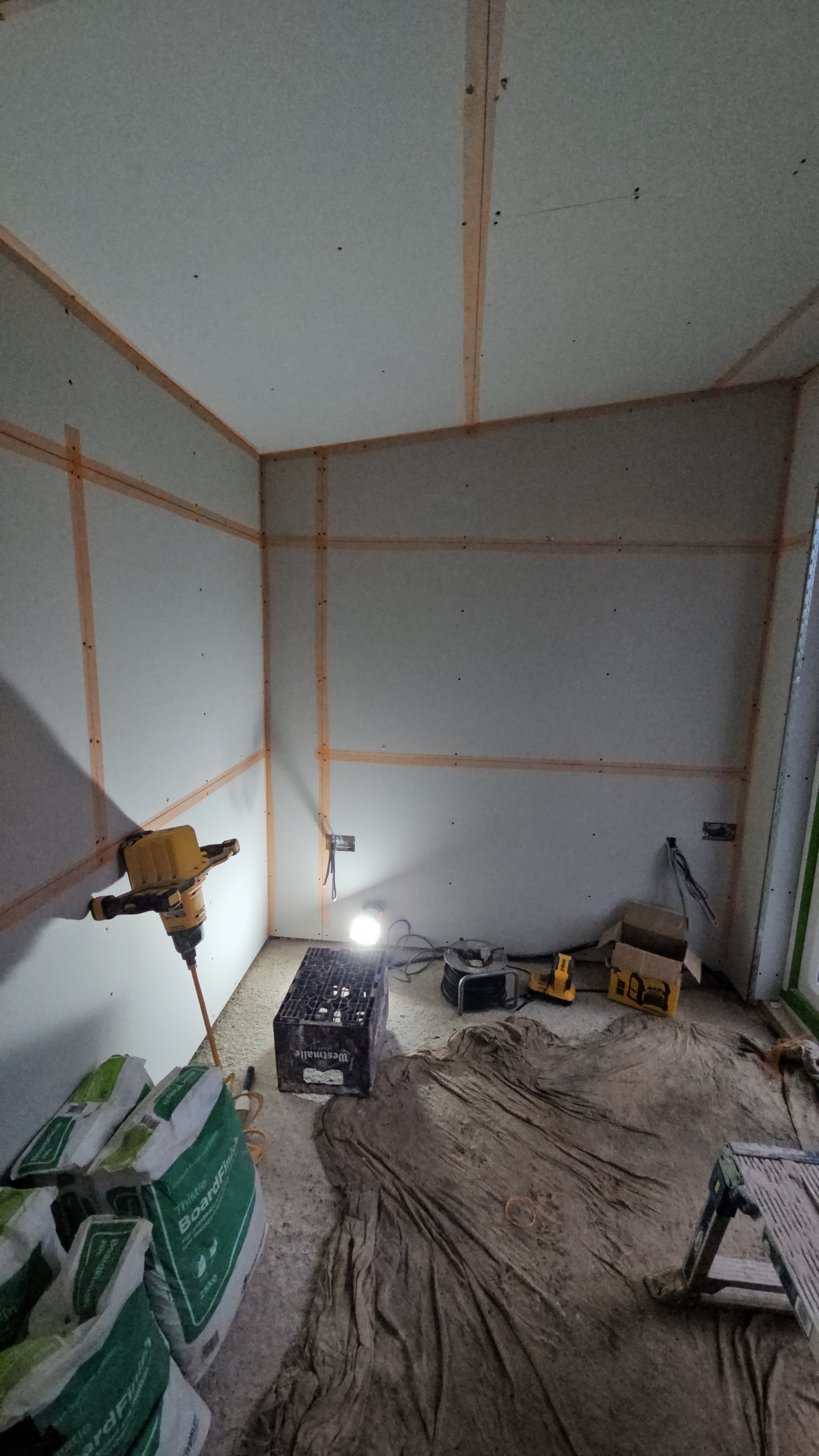 A room plaster boarded with taped joints, ready for skimming